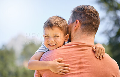 Buy stock photo Happy, father and son hug, park and happiness with quality time, support and loving together. Outdoor, dad and male child with a smile, kid and parent embrace, wellness and care with joy and family