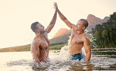 Buy stock photo Lake, high five and swimming with man friends outdoor in nature for travel or adventure while on summer holiday. Motivation, water or wet with a young male traveler and best friend on vacation