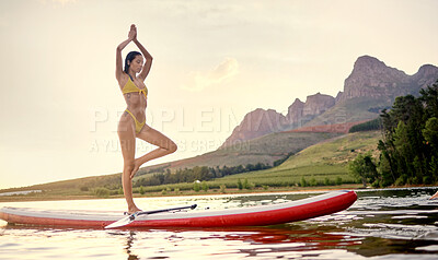 Buy stock photo Yoga, surfboard and woman balance on ocean, fitness and wellness for spiritual, peace and calm in bikini. Surfing board, flexible and person or surfer meditate, prayer hands or training on lake water