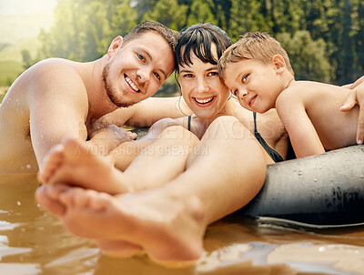 Buy stock photo Family, portrait and swimming in lake with happiness in nature, parents and child on summer vacation. Tube, adventure and fun outdoor with man, woman and boy in water with smile, travel and holiday