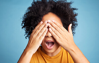 Buy stock photo Shock, scared and woman closing her eyes in a studio for fear, horror or panic expression. Surprise, emotion and crazy female model with a cant look gesture or emoji isolated by a blue background.