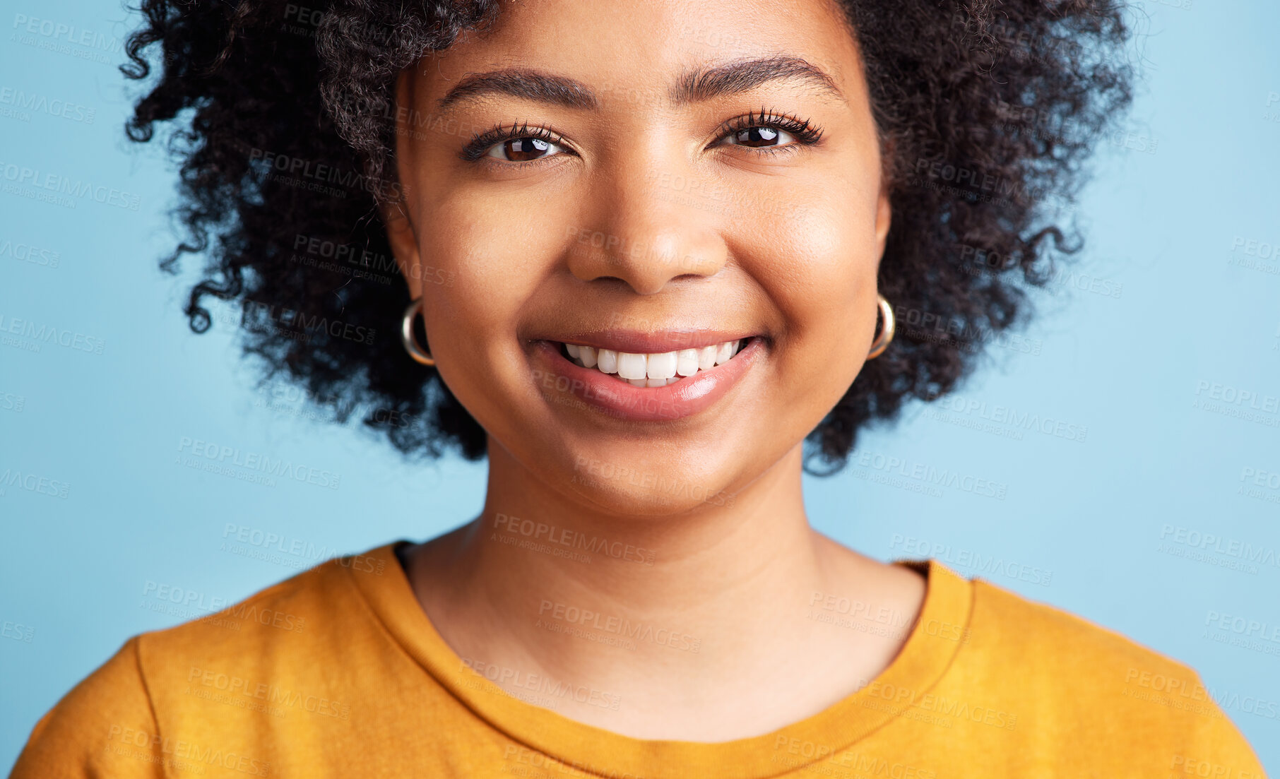 Buy stock photo Happy, woman and portrait with natural beauty, confidence or makeup on studio blue background. Face, happiness or person with African hair, afro or smile in salon for hairstyle care or skincare