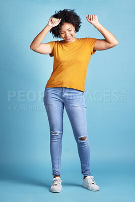 Buy stock photo Energy, happy or woman celebrate, dancing and winning with opportunity, music or motion. Female person, model or girl with a smile, dance or excitement with victory or fun on a blue studio background