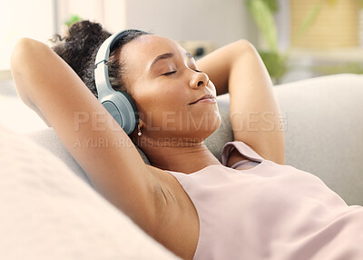Buy stock photo Music headphones, meditation and woman on sofa in home living room for streaming. Relax, couch and African person listening to radio, audio or podcast, jazz and sound for calm, peace or mindfulness.
