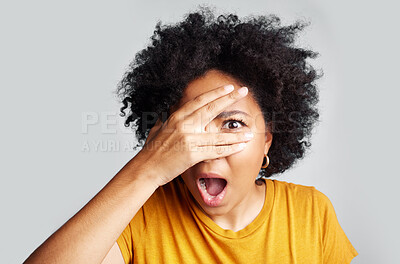 Buy stock photo Surprise, wow and woman peeking through hand isolated on a white background in studio. Shocked, face and African female person shy, embarrassed or fear, scared or shame, emoji or mind blown portrait.