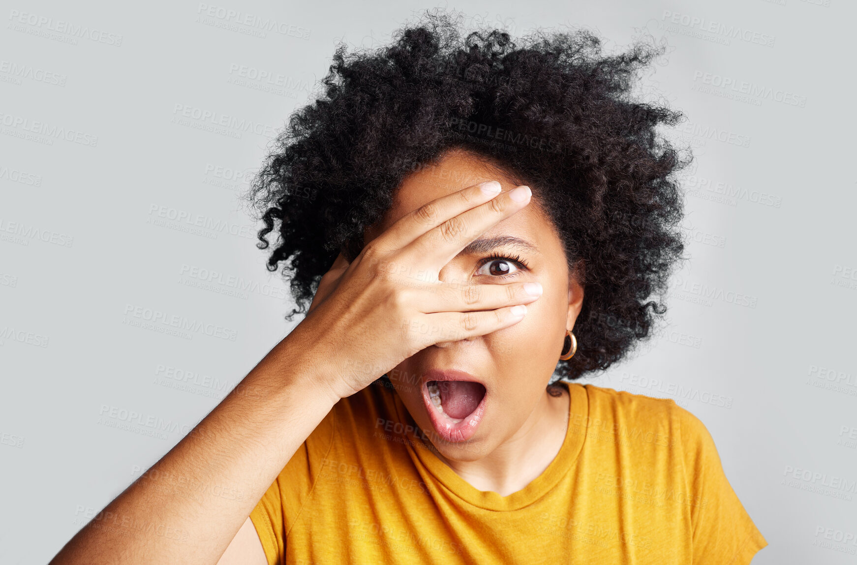 Buy stock photo Surprise, wow and woman peeking through hand isolated on a white background in studio. Shocked, face and African female person shy, embarrassed or fear, scared or shame, emoji or mind blown portrait.