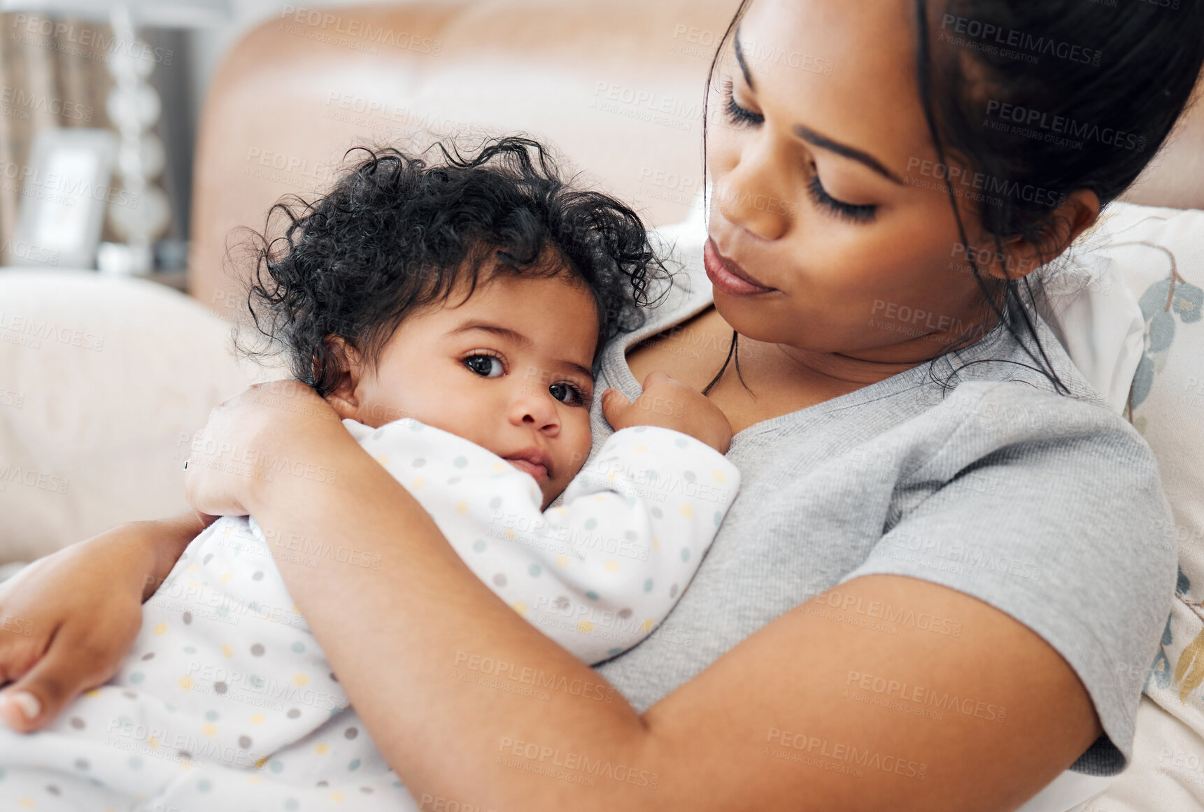 Buy stock photo Shot of a mother snuggling her baby girl