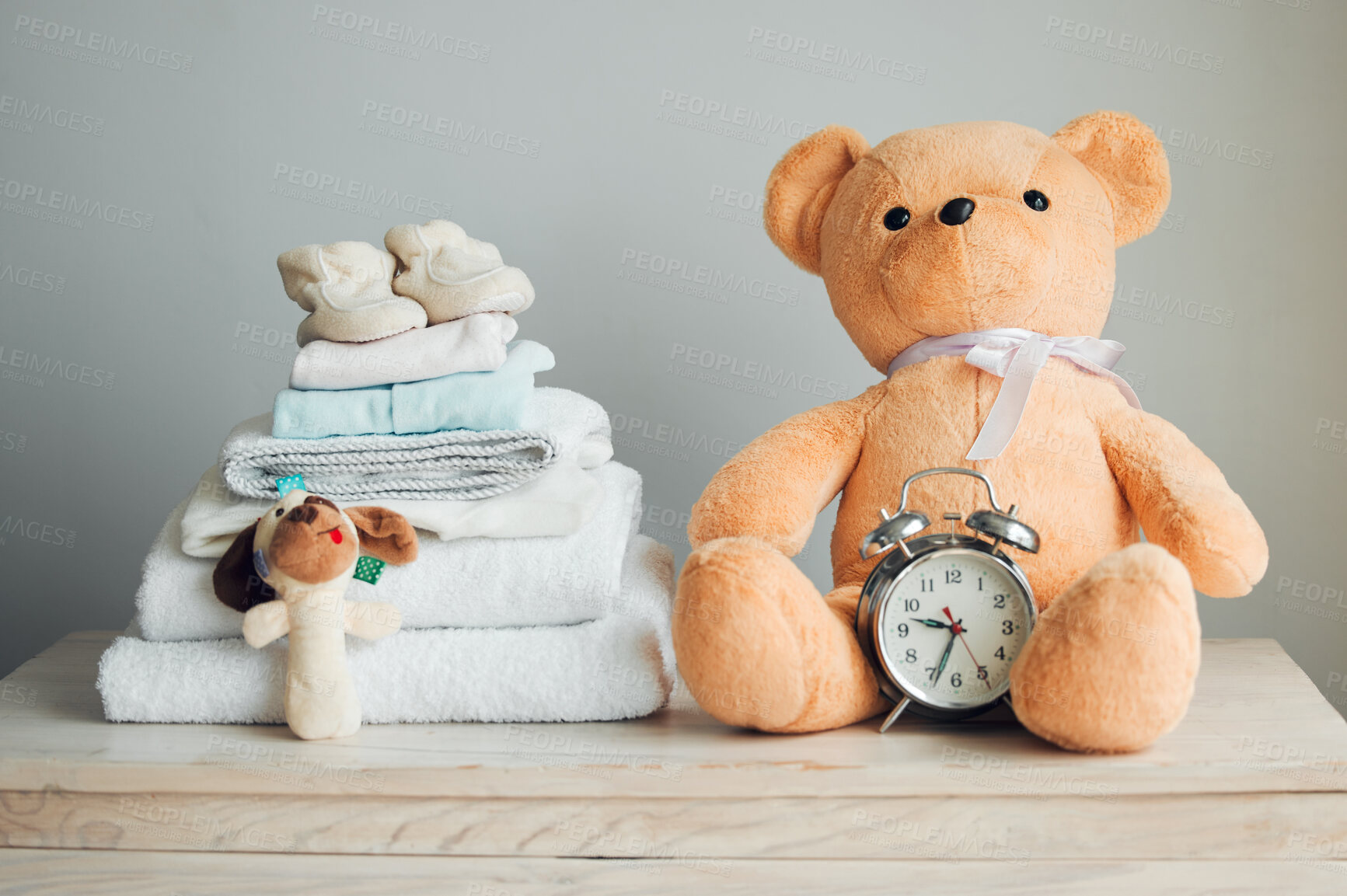 Buy stock photo Baby toys, clothes and teddy bear with clock for childcare, pregnancy and maternity in family home. Waiting, progress and due date in nursery for infant, birth and newborn with excited for parenthood