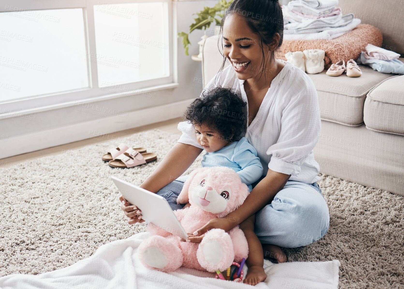 Buy stock photo Home, mom and baby with tablet for connection, streaming cartoon and watching show for children. Teddy bear, happy mother and girl with digital for online video, game subscription and bonding on rug