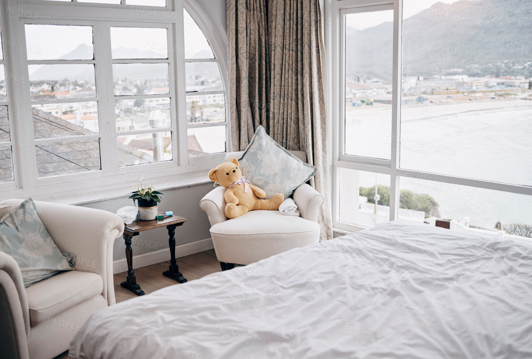 Buy stock photo Bedroom, chair and home with furniture, window and comfort for relax, setup or interior design. Hotel, armchair and table in modern house for lodge, apartment or accommodation with remodeling or rent