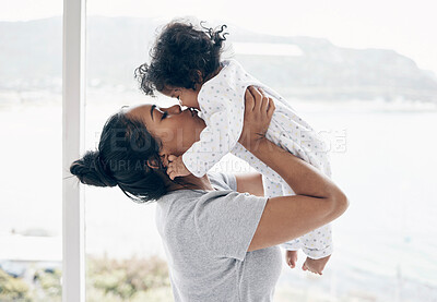 Buy stock photo Bonding, mother and kiss baby in home for security, child development and morning routine by window. Parenting, woman and infant in bedroom with affection, protection and relationship with connection