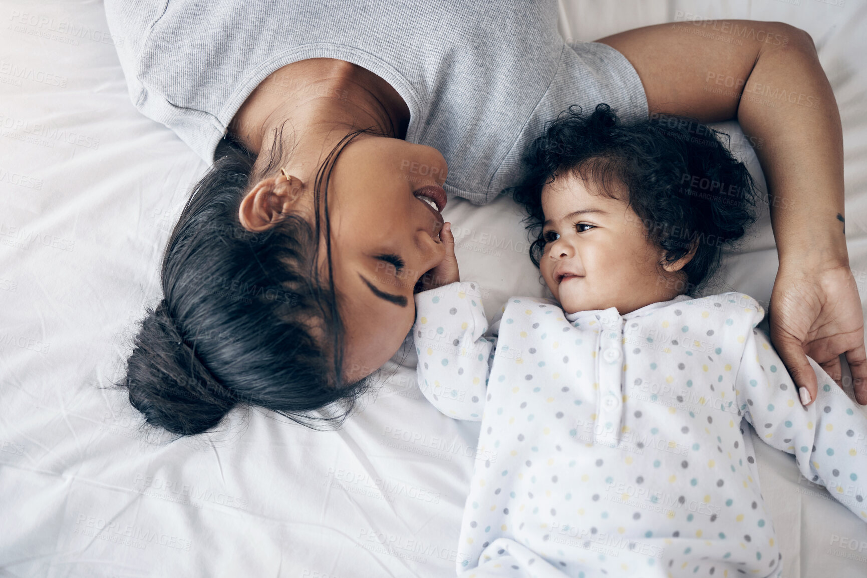 Buy stock photo Bonding, mother and playing with baby in home for affection, child development or morning routine on bed. Top view, woman and infant in bedroom for parenting, protection or relationship with security