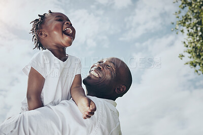 Buy stock photo Shot of a young father and daughter spending time together outside