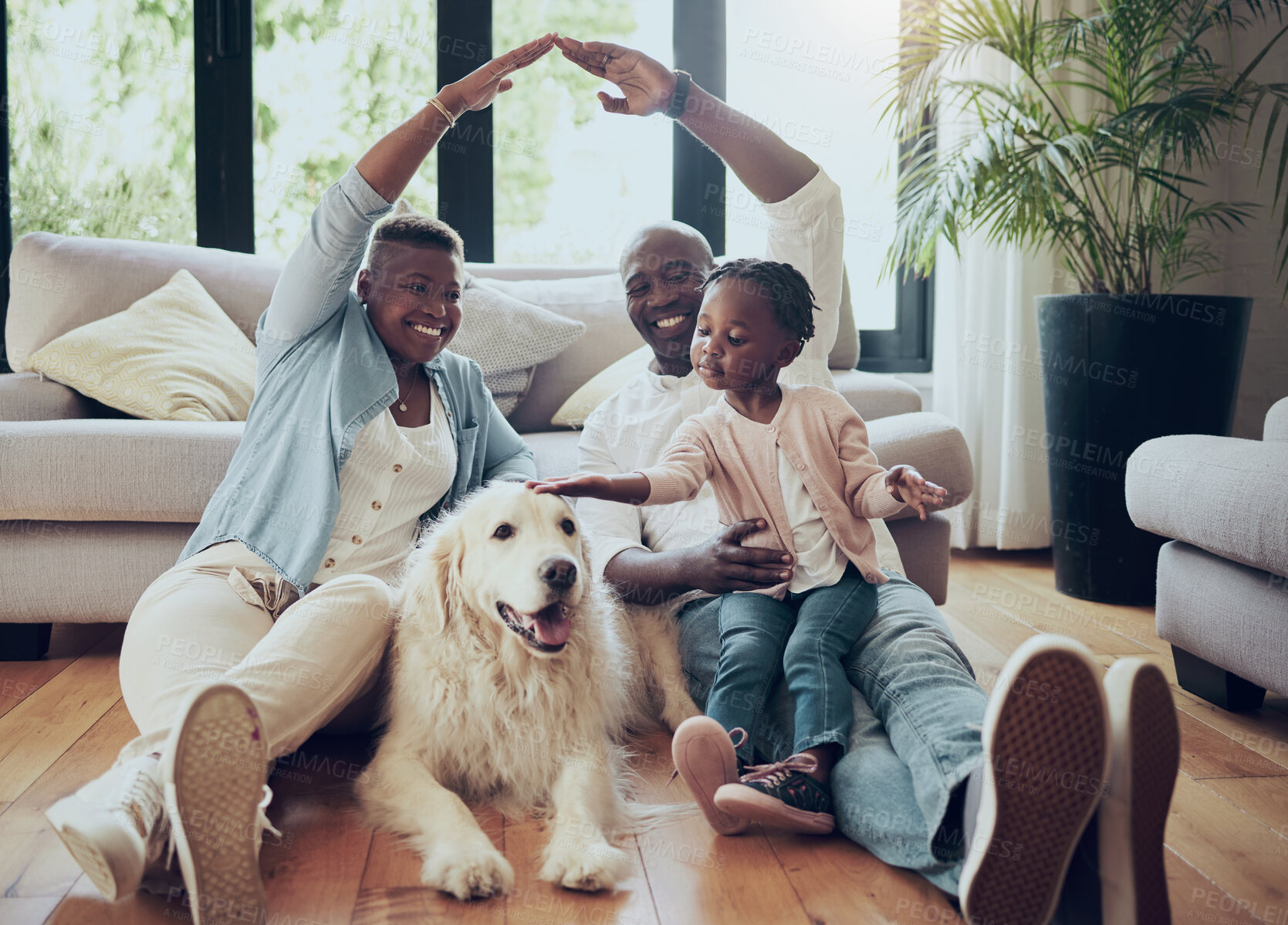 Buy stock photo Portrait, roof and family in home with dog, mother or dad with love, child or cover for support. Hands, insurance or happy mom with African father or girl kid with pet or golden retriever in Namibia