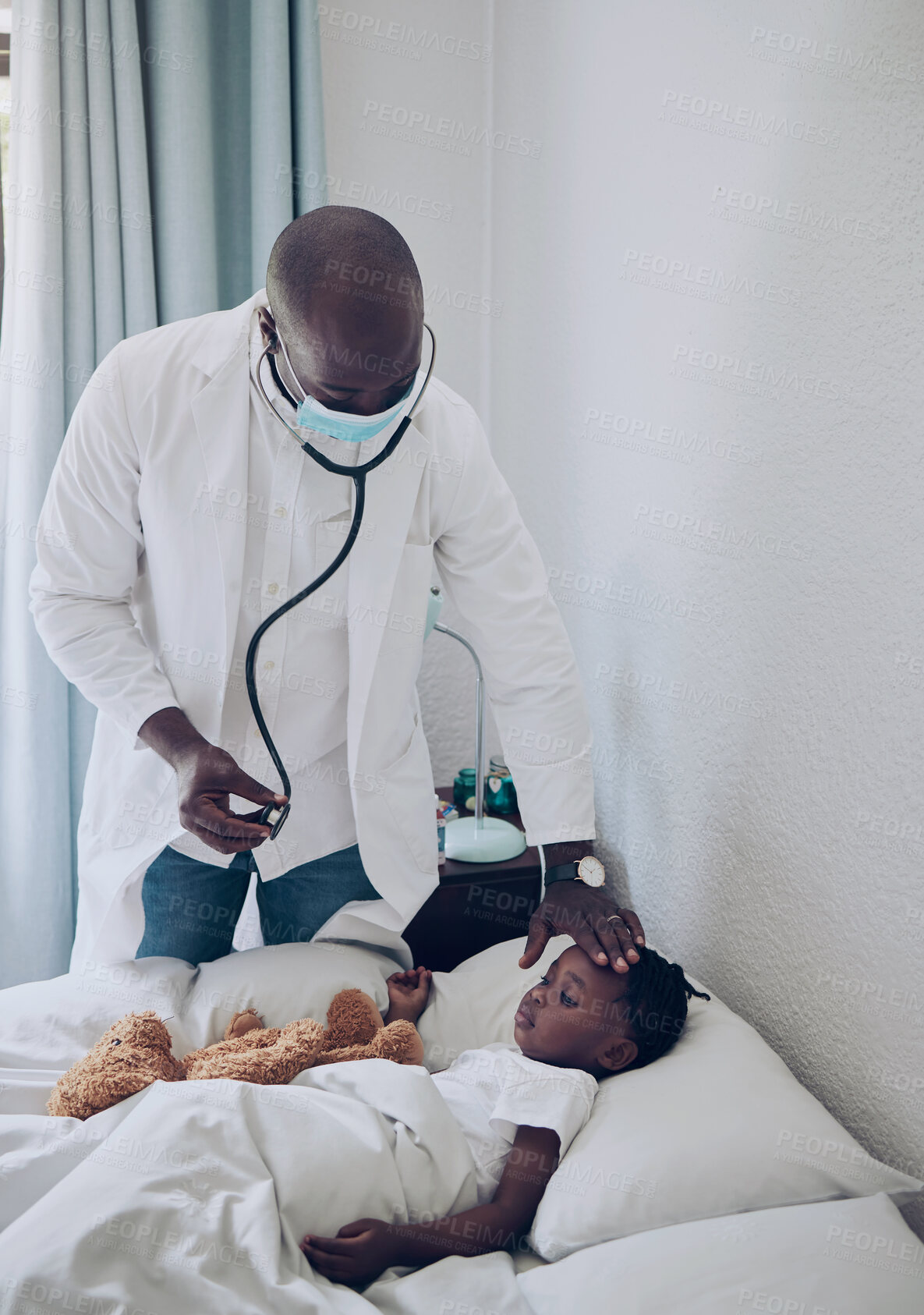 Buy stock photo Doctor, black man and fever check for child in home, consultation and monitor temperature. Medic, healthcare and physical symptoms of sick kid in bedroom, touch forehead and pediatrician helping