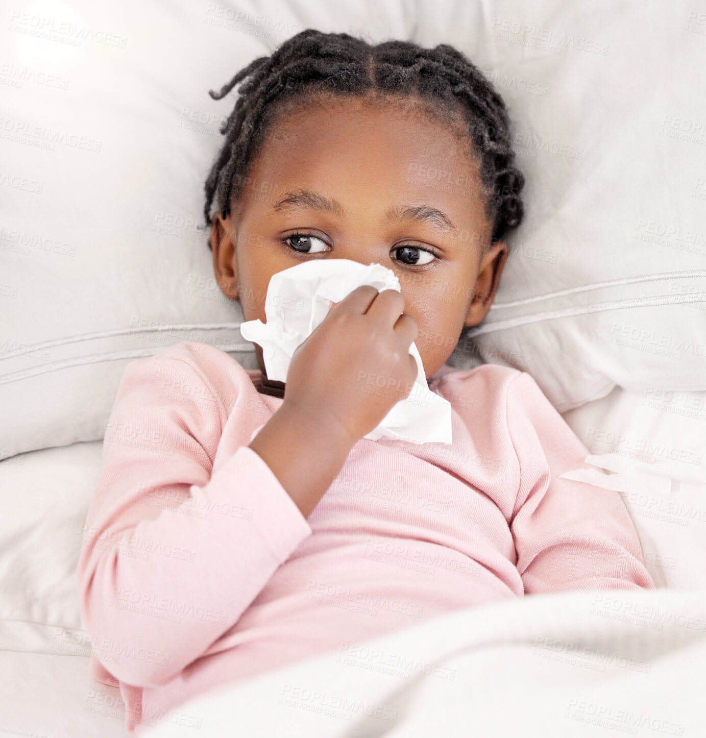 Buy stock photo Child, sick and black girl with tissue in bed for allergies, cold flu or sneeze in bedroom, Healthcare, disease and young kid suffering with viral infection, nose congestion or hay fever in home