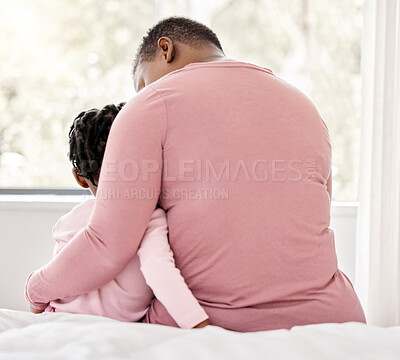 Buy stock photo Black family, mother and girl with hug in bed in home for love, child care and bonding together. Apartment, back and female parent with daughter for relaxing, comfort and embrace in bedroom