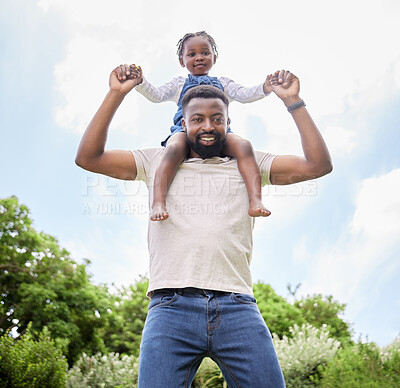 Buy stock photo Portrait of a father carrying his daughter on his shoulders outdoors
