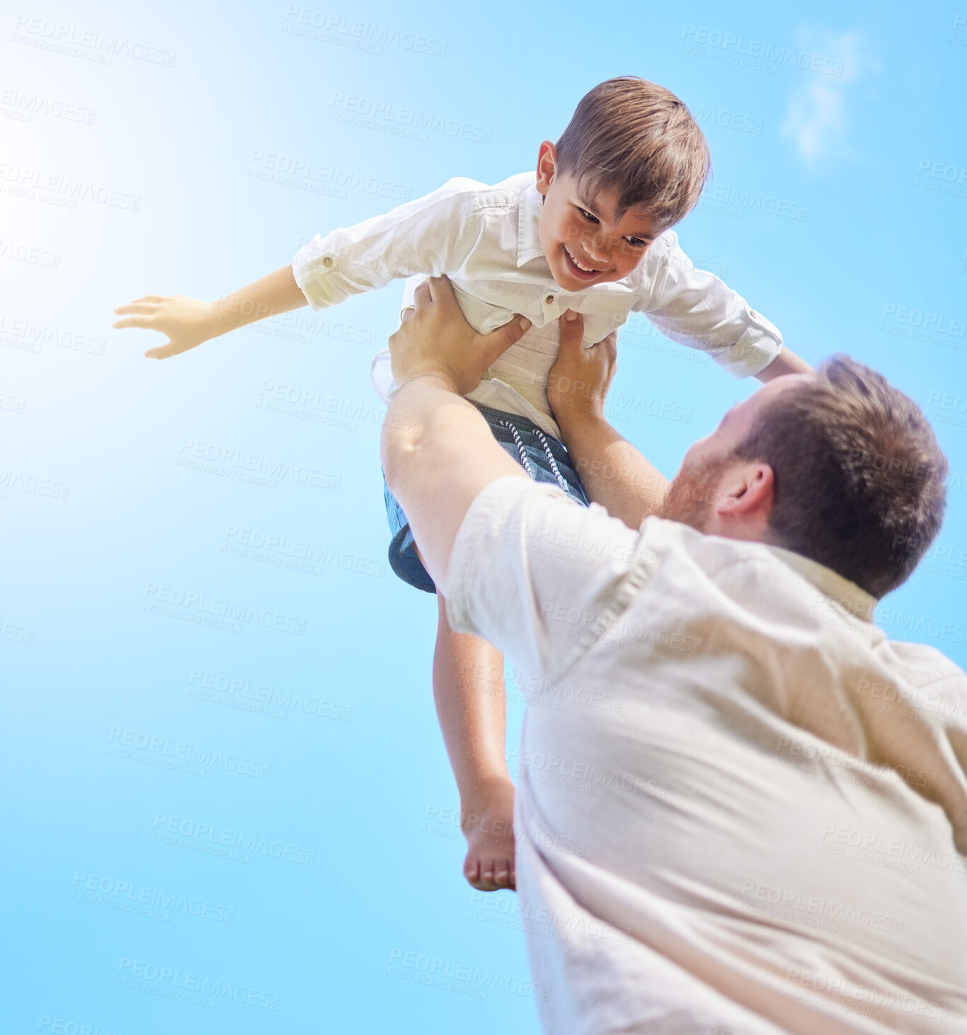 Buy stock photo Father, happy child and airplane game outdoor on low angle in blue sky for family bonding, care or love in summer. Dad, smile and lifting kid for playing, connection or support of parent with freedom