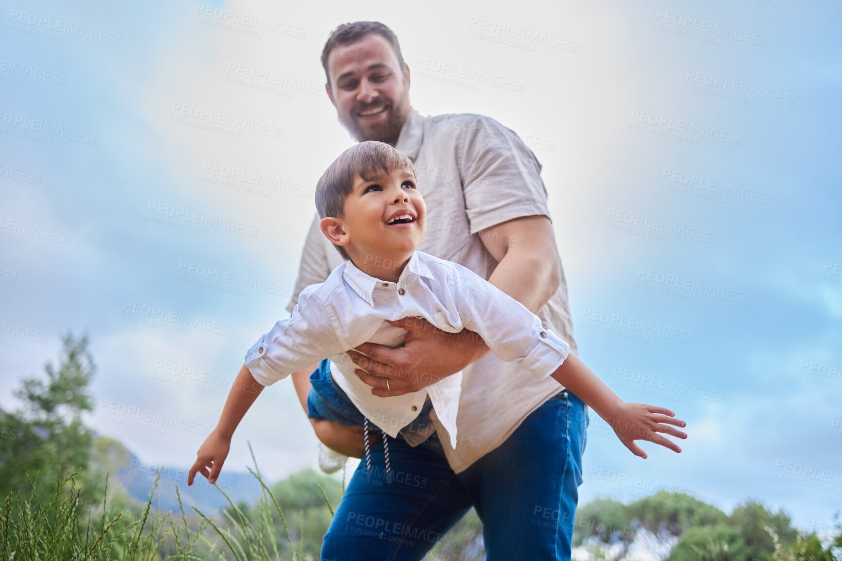 Buy stock photo Carry, flying or plane with father and son outdoor in park on blue sky for summer bonding together. Love, smile or trust with man single parent and happy boy child having fun or playing in nature