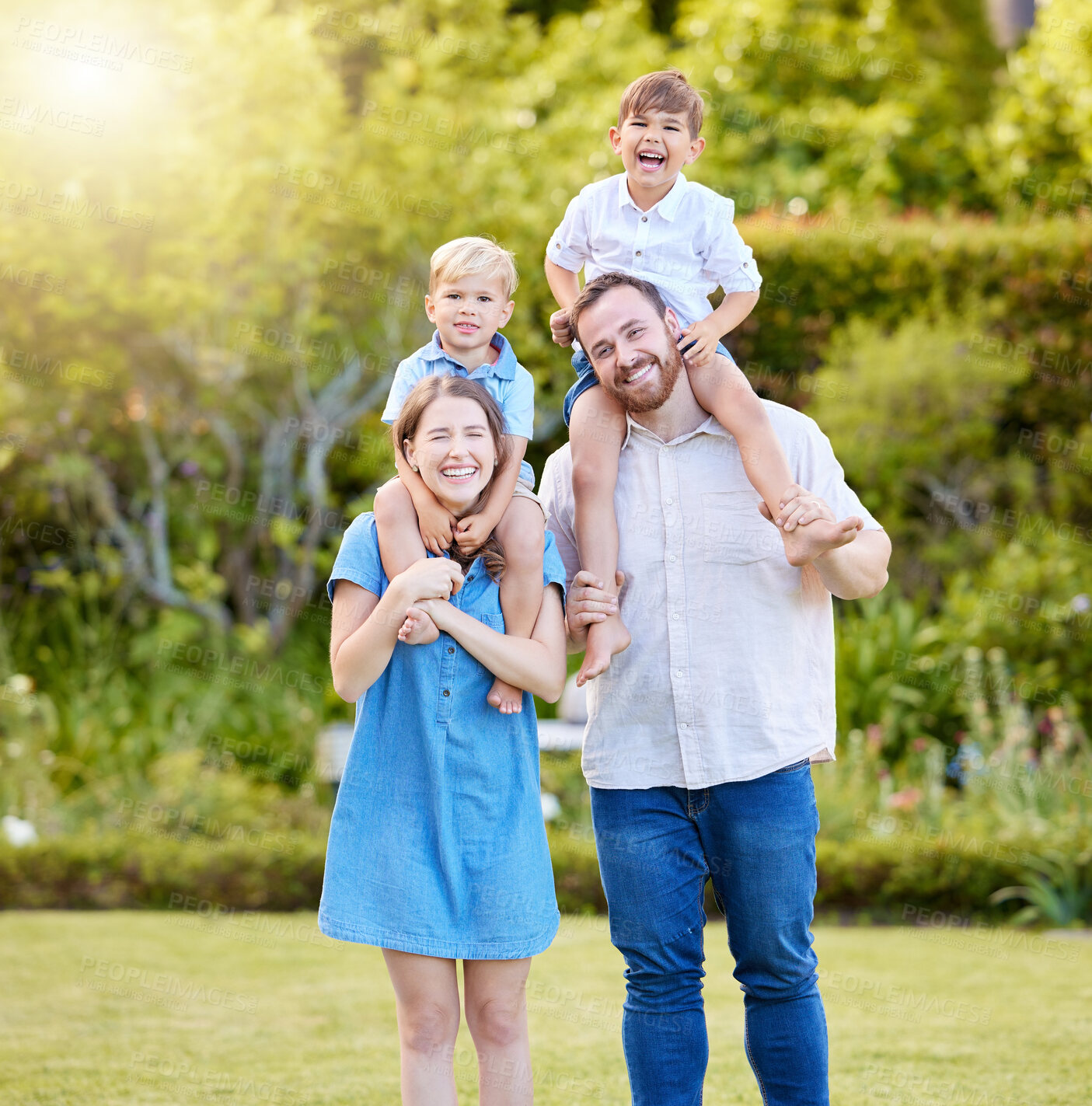 Buy stock photo Smile, portrait and children on parents shoulders in nature with hug, love and care for bonding together. Happy, fun and boy kids playing with mother and father in outdoor park, field or garden.