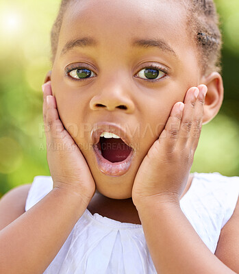 Buy stock photo Shot of a little girl looking surprised in nature