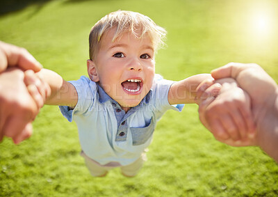 Buy stock photo Happy boy, hands and swing with parent on grass field for playful holiday, weekend or outdoor fun at park. Little kid or young child with smile for bonding, joy or playing in happiness, pov or nature