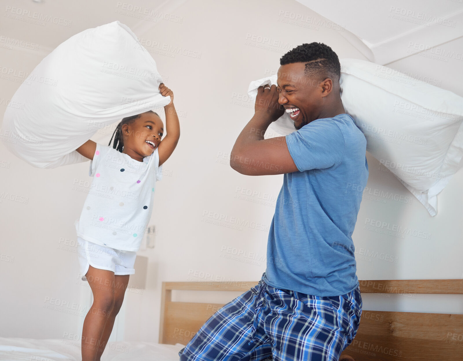 Buy stock photo Dad, child and happy pillow fight in bedroom with morning games, bonding and playful black family in home. Smile, father and daughter playing together on bed with love, fun and wake up with energy.