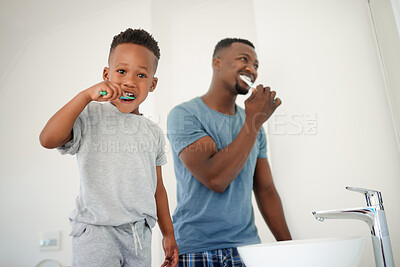 Buy stock photo African father, bathroom and son with toothbrush, care or love for cleaning, hygiene or dental wellness. Black man, boy and brushing teeth in family house with health, smile or clean mouth in morning