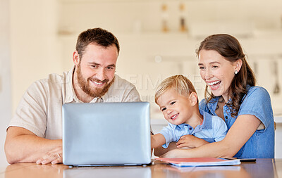 Buy stock photo Shot of a young mother and father helping their son with his homework using a laptop