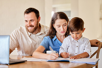 Buy stock photo Shot of a young mother and father helping their son with his homework using a laptop