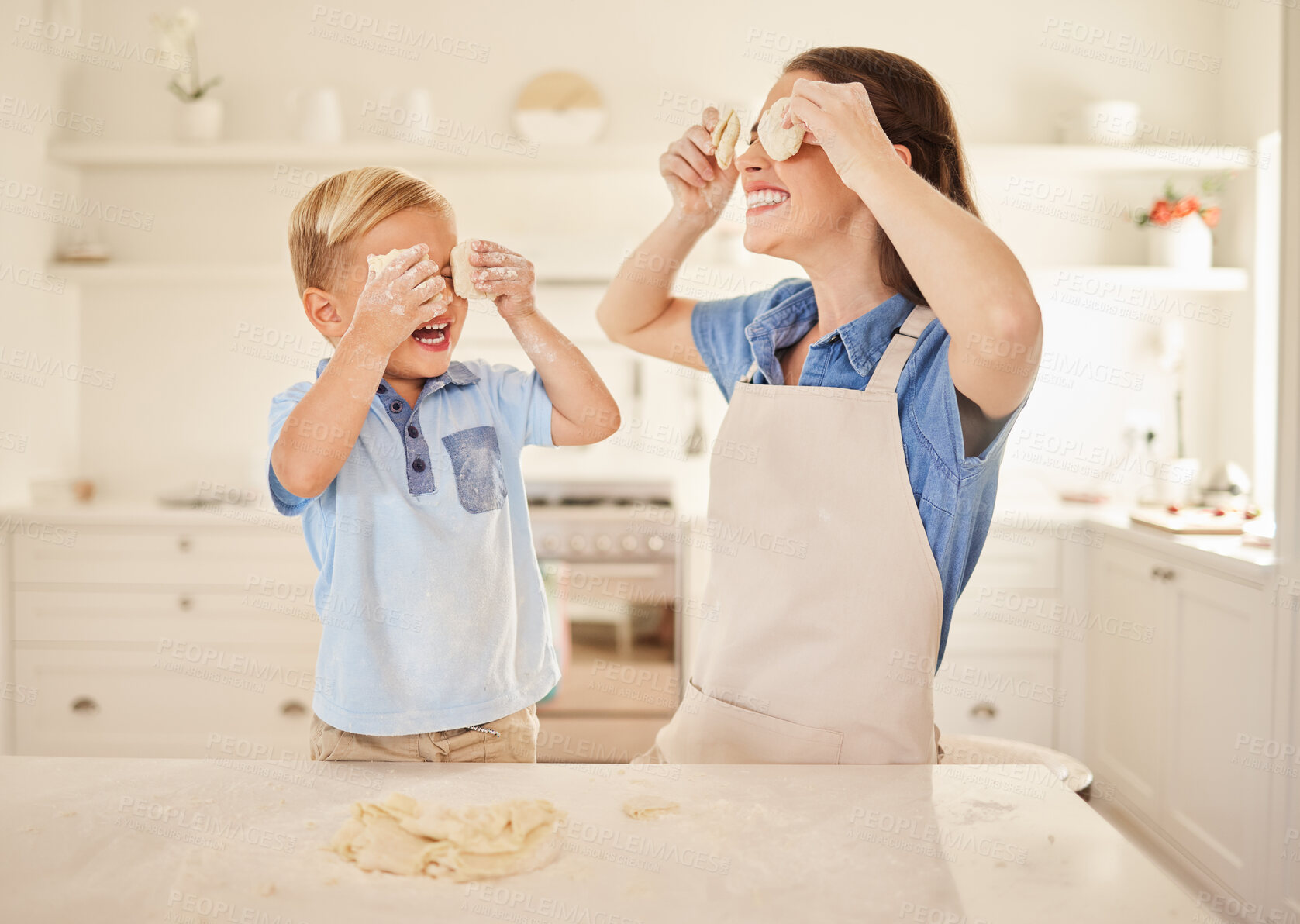 Buy stock photo Dough, baking and mother in kitchen, son and playful with happiness, bonding together and hobby. Family, single parent and mama with boy, home and cooking with ingredients, fun and cheerful with joy