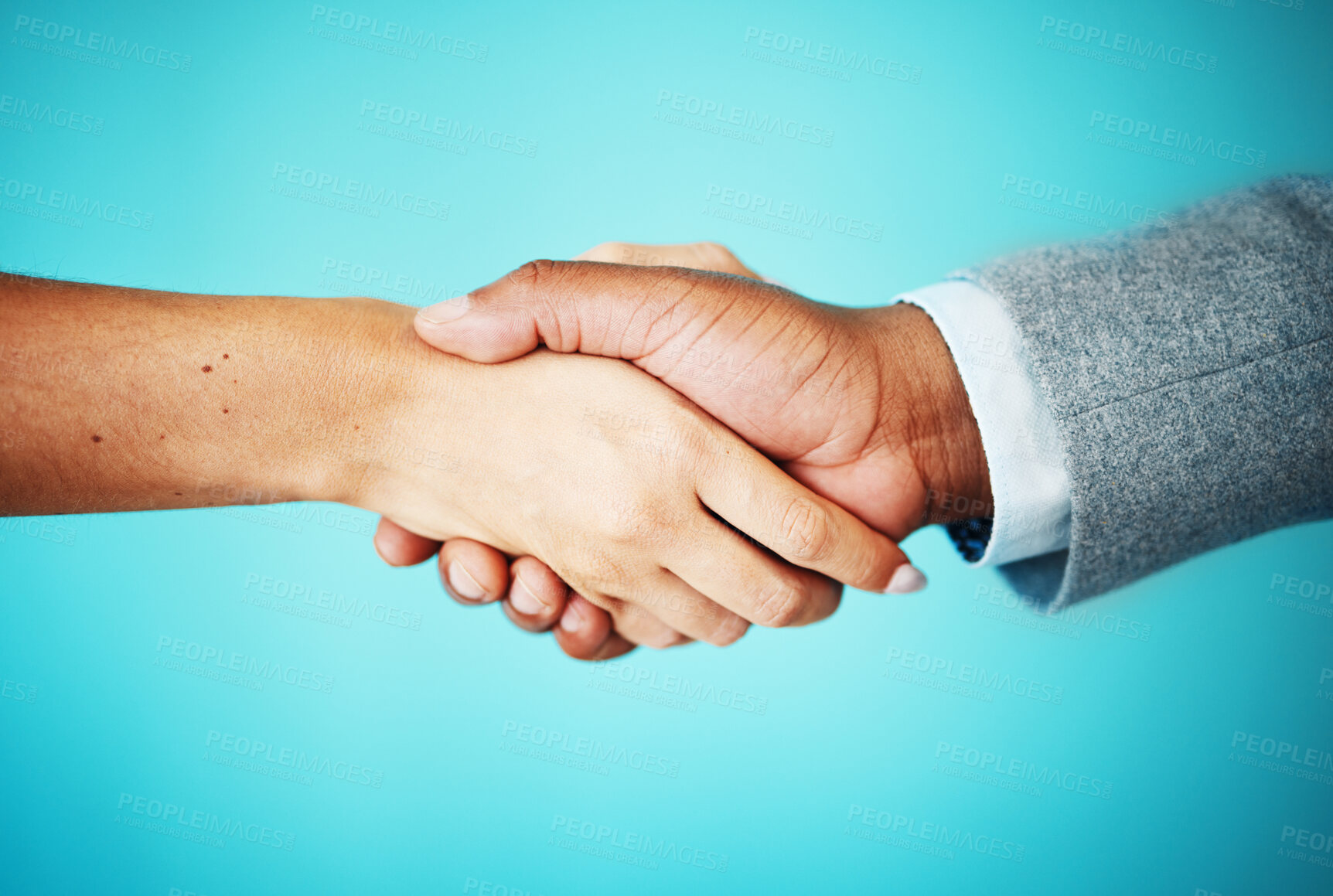 Buy stock photo Business people, studio and handshake closeup for merger negotiation, funding agreement and b2b deal. Blue background, meeting and entrepreneur greeting investor for collaboration and partnership