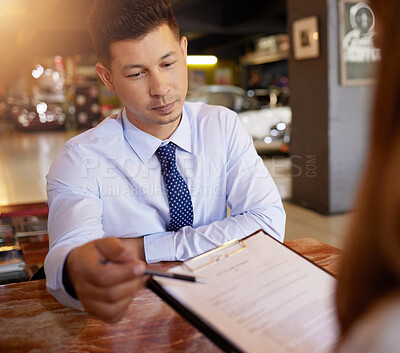 Buy stock photo Man, contract and talking to client in car dealership, loan and finance for classic vehicle in shop. Salesman, documentation or paperwork for discount, deal or agreement with payment plan in showroom