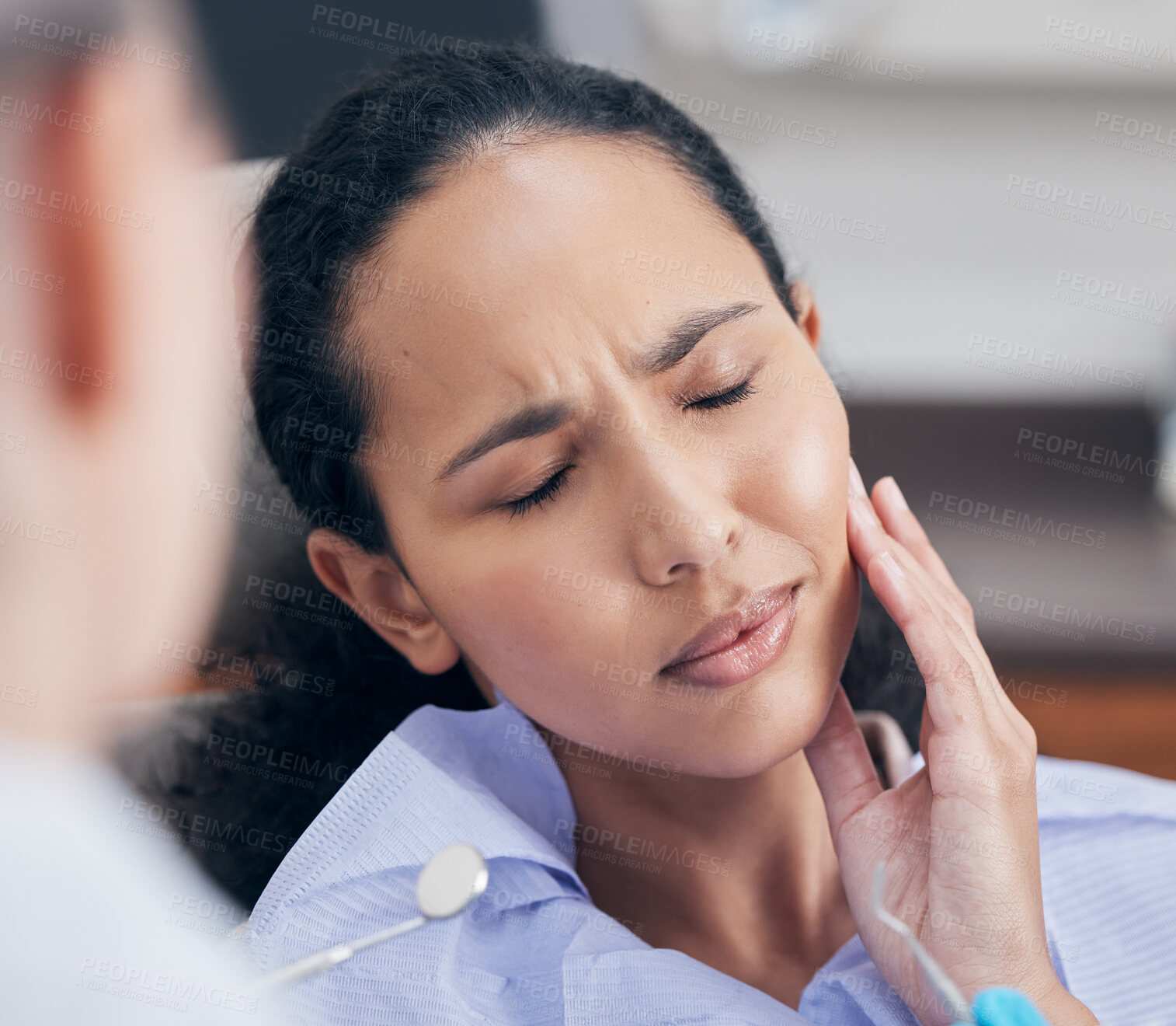 Buy stock photo Woman, toothache and pain at dentist for consultation with discussion, problem and tooth injury for medical dental treatment. Patient, orthodontist and appointment for extraction help of gum disease