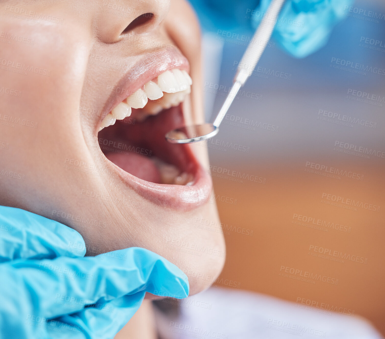 Buy stock photo Shot of a woman about to have her teeth checked by the dentist