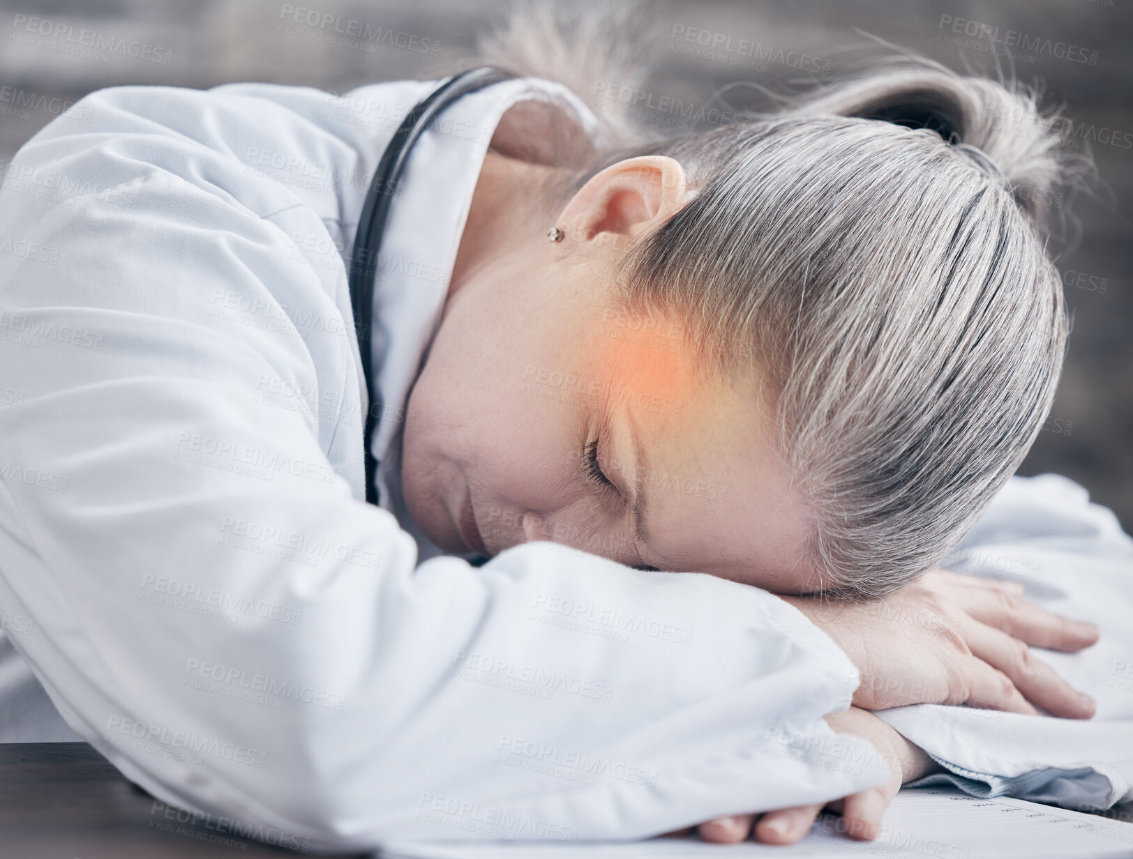 Buy stock photo Woman, headache and doctor sleeping with fatigue for burnout and stress for healthcare job in clinic. Senior lady, tired surgeon and red glow on temple for migraine pain with insomnia and work break