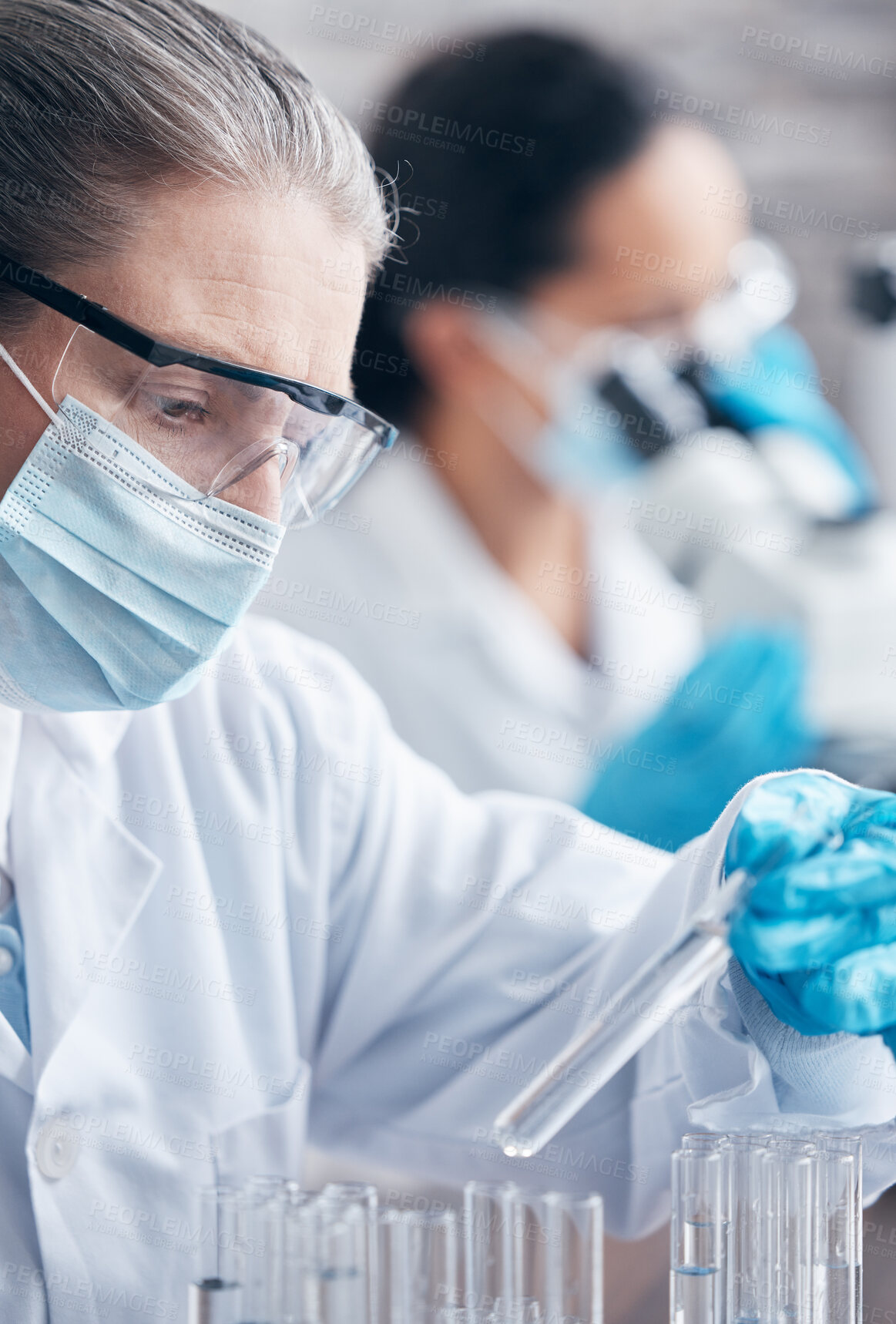 Buy stock photo Test tube, mask and female scientist for innovation in laboratory for research, medical and health. Woman, ppe and working in clinic for pharmaceutical company and investigation for vaccine or safety