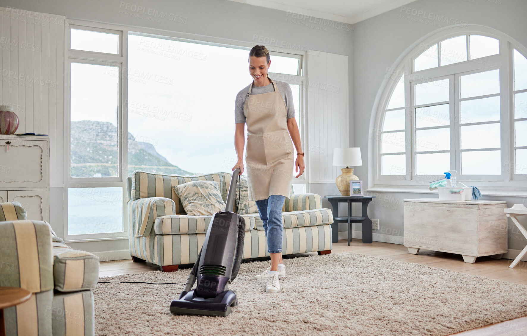 Buy stock photo Home, smile and woman with vacuum in cleaning for hygiene, housekeeping and chores on weekend. Happy, female person and floor with electrical equipment for germs, dust and dirt removal in living room