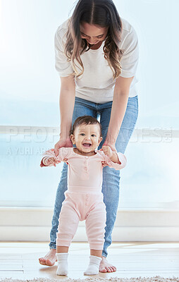 Buy stock photo Happy, walking and baby in home with mother and smile for growth, development and support or trust. First steps, woman and kid in lounge for learning, teaching and together for exercise and balance 