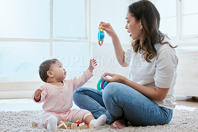 Buy stock photo Home, mom and baby with toys for playing, bonding and and child development on floor in nursery. Relax, mother and infant daughter on carpet together with games for growth, motor skills and learning