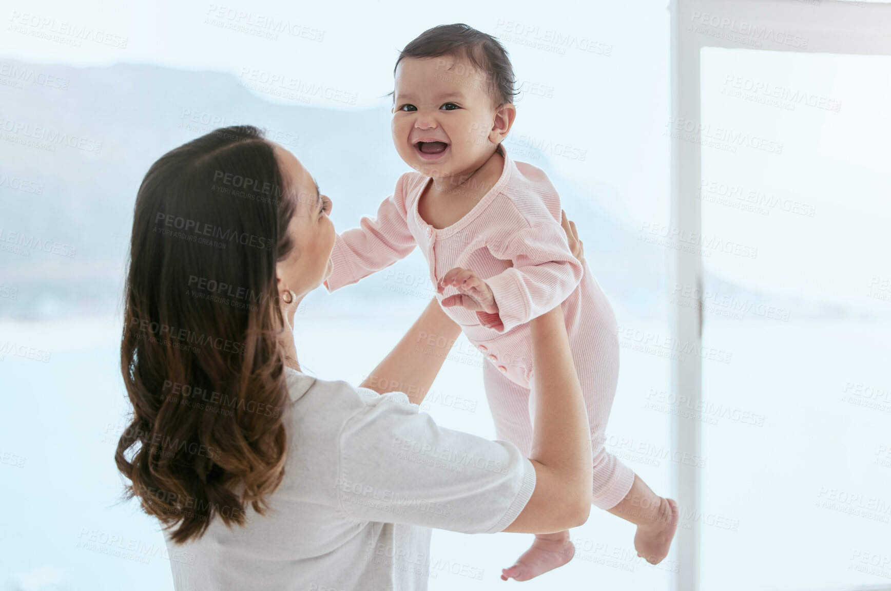 Buy stock photo Baby laugh, portrait and mom in a home with newborn, care and parent love together with fun. Face, family and young child with mother back in a living room in house with mama and childcare in lounge