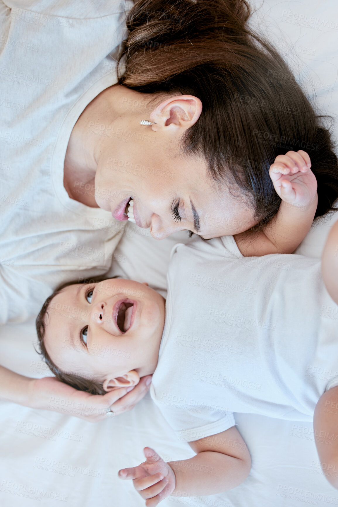 Buy stock photo Smile, mom and baby on bed with love, bonding and laughing together in home from above. Relax, happy mother and infant girl in bedroom with fun for growth, playing and support in child development