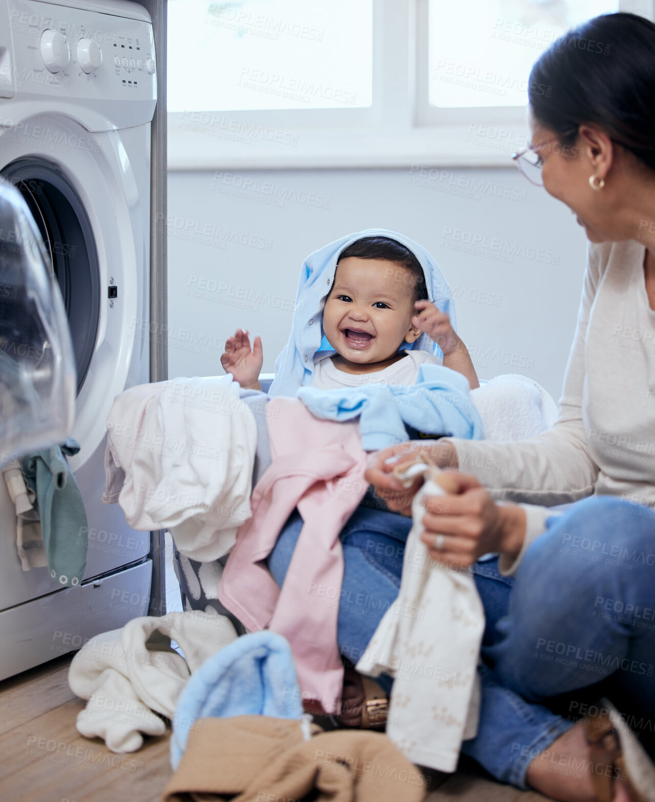 Buy stock photo Happy, mom and baby in basket with laundry, bonding and child development for toddler in home. Housekeeping, mother and infant girl playing together with clothes, washing machine and cleaning games