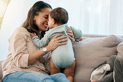 Buy stock photo Love, happy and mother with baby on a sofa for playing, games and laughing in their home together. Family, smile and mom with girl toddler on a couch, relax and bonding, fun and hug in a living room