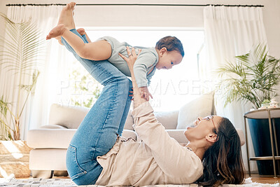 Buy stock photo Play, love and mother lift baby for bonding, quality time and child development together in family home. New born, motherhood and happy mom with infant for care, support and playing in living room
