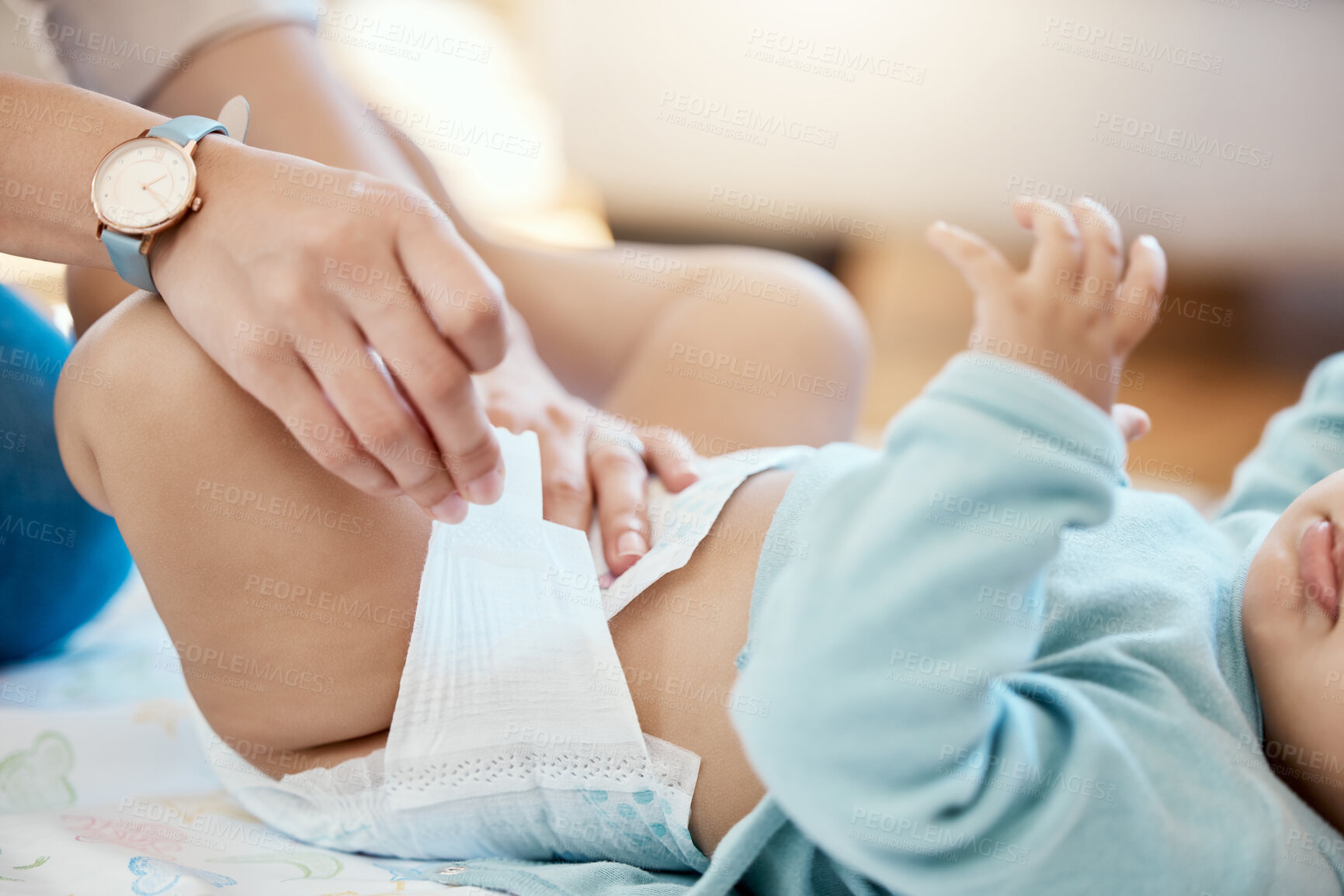 Buy stock photo Diaper change, hands of mom and baby with calm cleaning time, bonding and parent with newborn getting dressed. Parenthood, child and mother changing nappy on bed with love, care and hygiene in home.