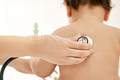 Buy stock photo Closeup shot of a paediatrician using a stethoscope during a baby's checkup