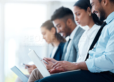 Buy stock photo Shot of an group business people sitting and using his laptop while waiting for an interview in the office