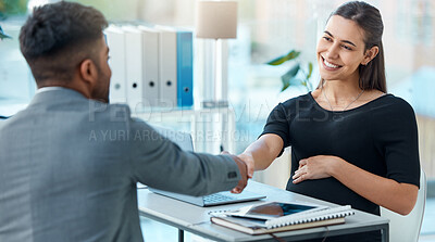 Buy stock photo Shot of a pregnant businesswoman shaking hands with a businessman in an office
